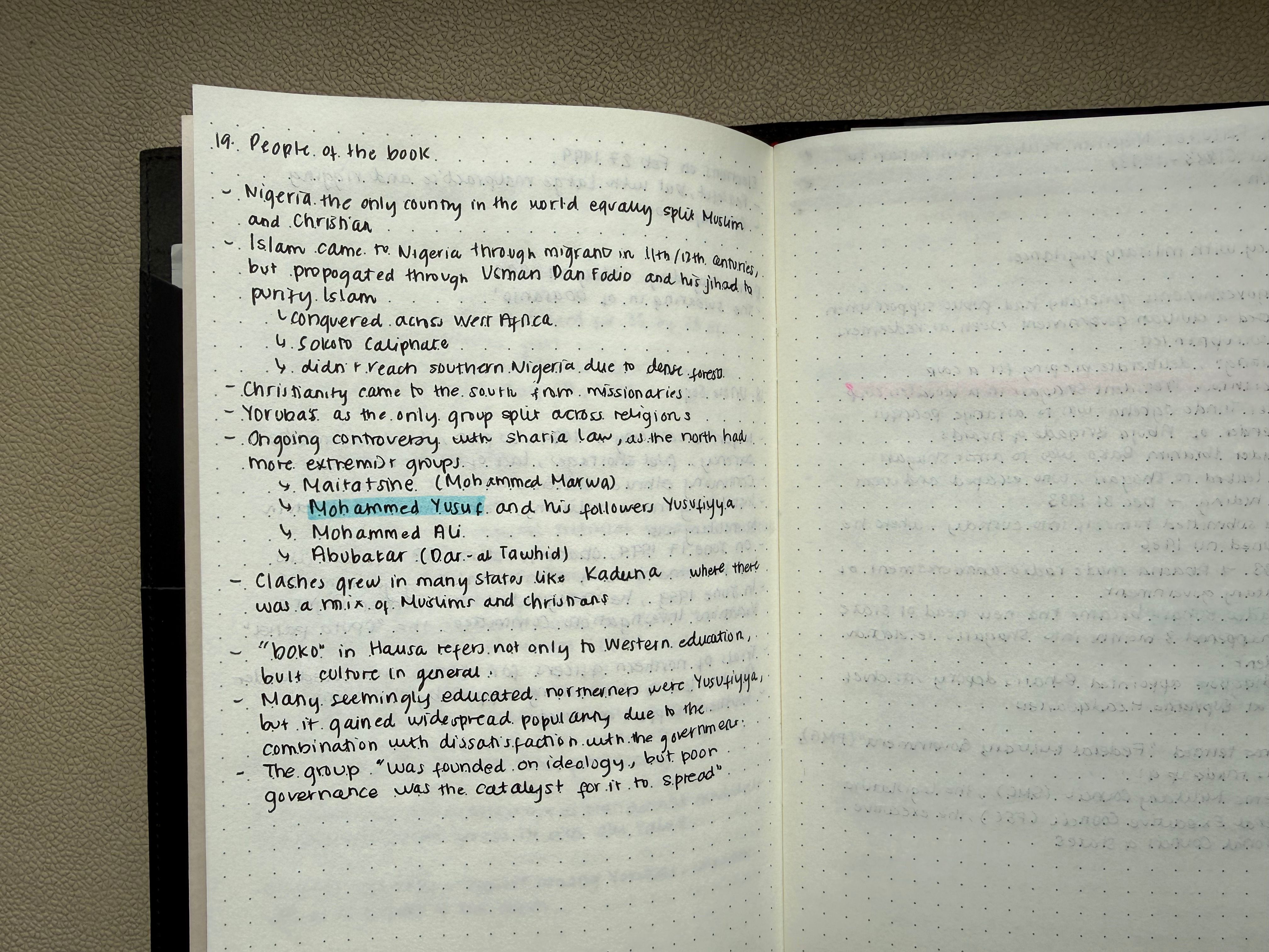 Handwritten chapter summaries in a notebook